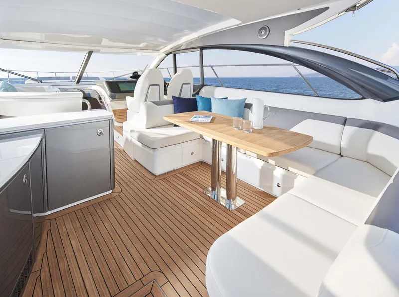 Slide: The Image of Luxurious 2025 Princess V50 Open yacht interior with elegant seating and ocean view. - 5