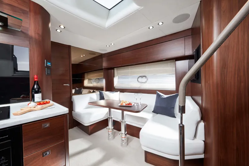 Slide: The Image of Luxurious interior of 2025 Princess V50 Open yacht with elegant seating and dining area. - 7