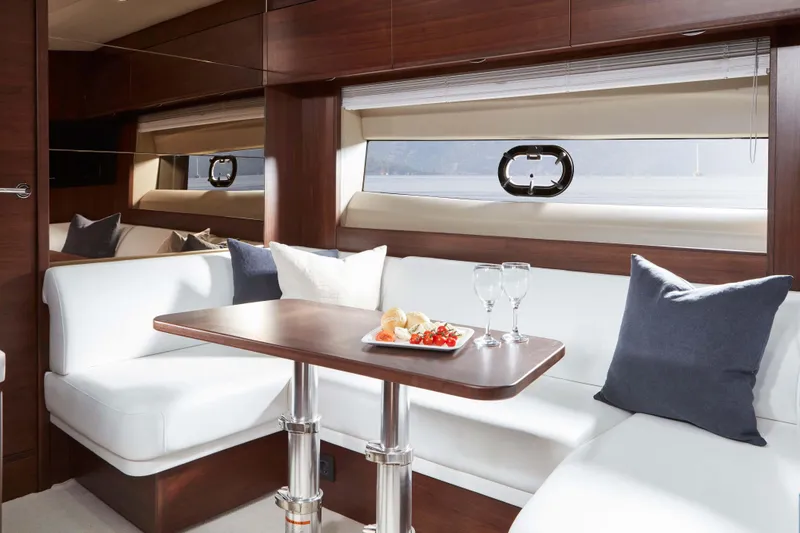 Slide: The Image of Luxurious interior of 2025 Princess V50 Open yacht with elegant seating and dining area. - 8
