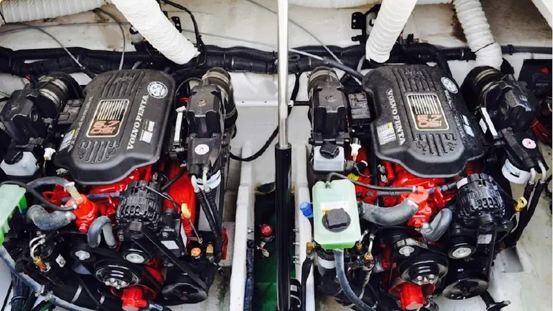 Slide: The Image of Twin engines in a 2008 Rinker 330 Express Cruiser boat engine compartment. - 9