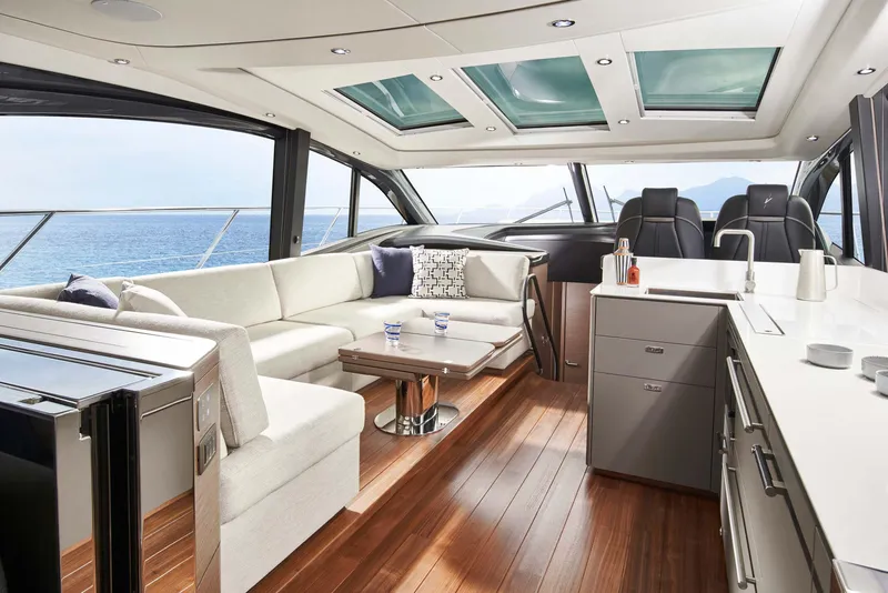 Slide: The Image of Luxurious interior of 2025 Princess V55 Express yacht with modern seating and ocean view. - 11
