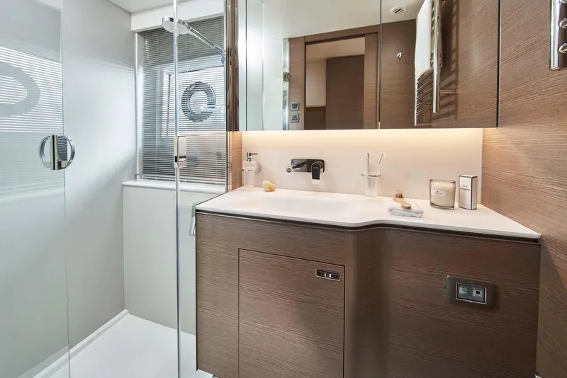 Slide: The Image of Luxurious bathroom in 2025 Princess V55 Express yacht with modern fixtures and elegant design. - 15