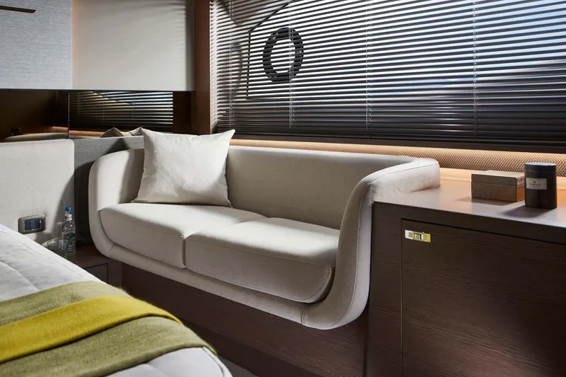 Slide: The Image of Luxurious interior of 2025 Princess V55 Express yacht with elegant sofa and modern decor. - 16