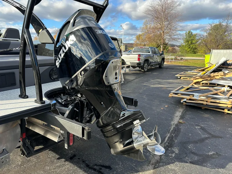 Slide: The Image of 2025 South Bay 525 ULDC with Suzuki outboard motor in parking lot. - 13