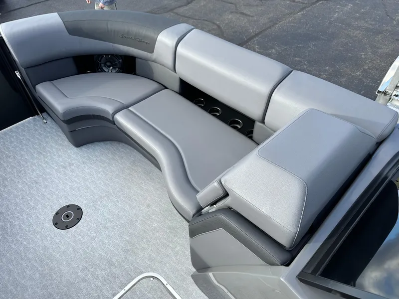 Slide: The Image of 2025 South Bay 525 ULDC boat interior with gray seating and cup holders. - 14