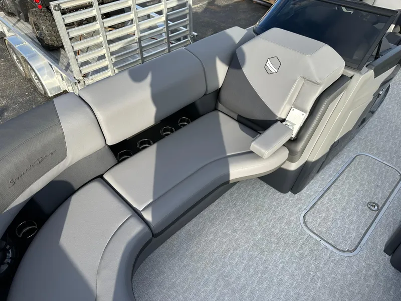 Slide: The Image of 2025 South Bay 525 ULDC boat interior with gray seating and modern design. - 7