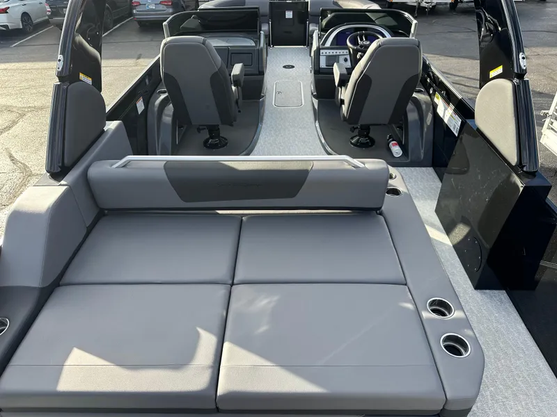 Slide: The Image of 2025 South Bay 525 ULDC boat interior with gray seating and modern design. - 8