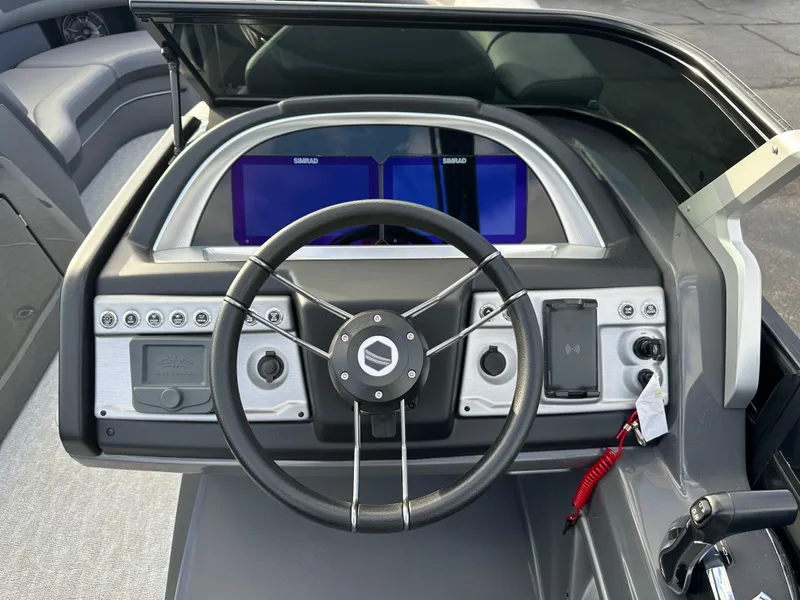 Slide: The Image of Steering console of 2025 South Bay 525 ULDC boat with modern controls and displays. - 9