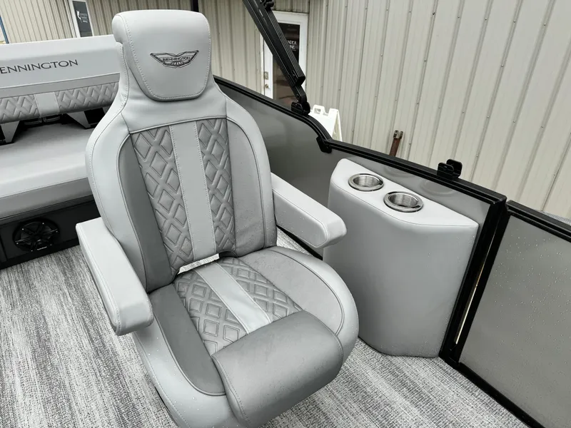 Slide: The Image of 2025 Bennington 22MSB boat interior with luxurious gray seating and cup holders. - 12