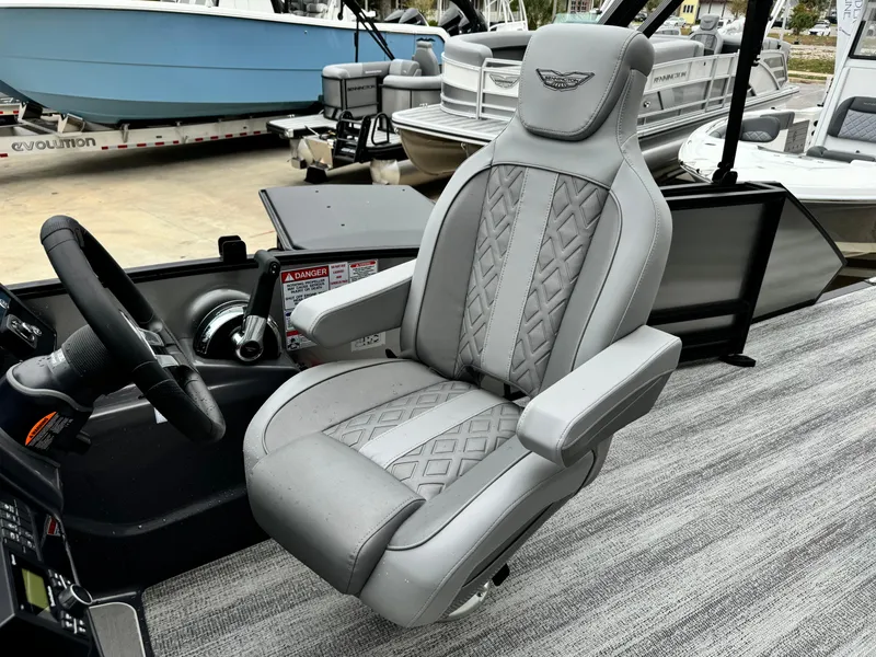 Slide: The Image of Luxury captain's chair on 2025 Bennington 22MSB boat, featuring elegant gray upholstery. - 13