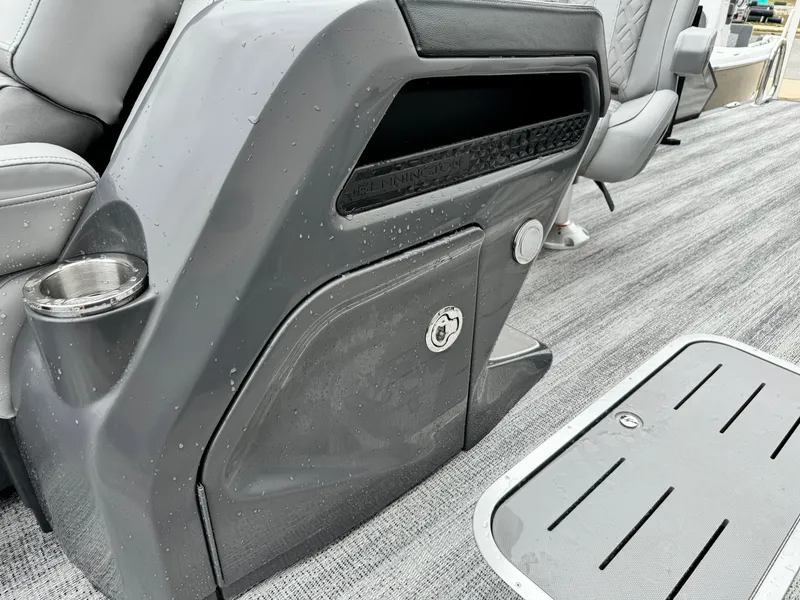 Slide: The Image of 2025 Bennington 22MSB interior detail with sleek gray console and seating. - 22