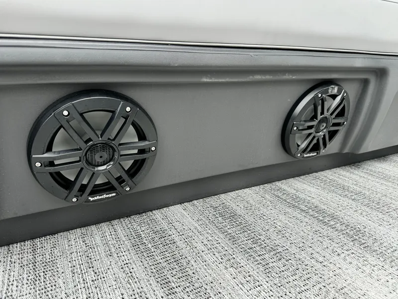 Slide: The Image of 2025 Bennington 22MSB boat speakers on gray interior panel. - 23