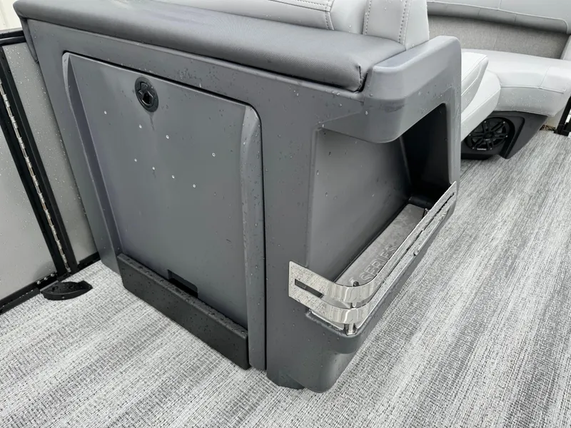 Slide: The Image of 2025 Bennington 22MSB boat interior with gray seating and storage compartment. - 25