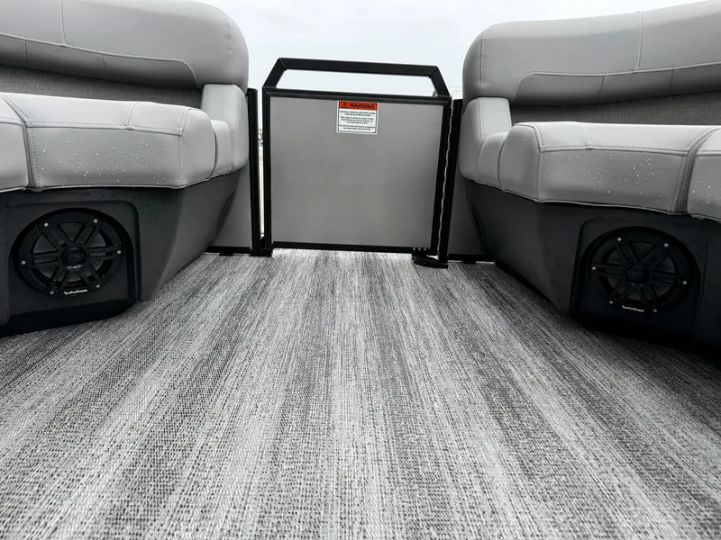 Slide: The Image of 2025 Bennington 22MSB boat interior with gray seating and flooring. - 26