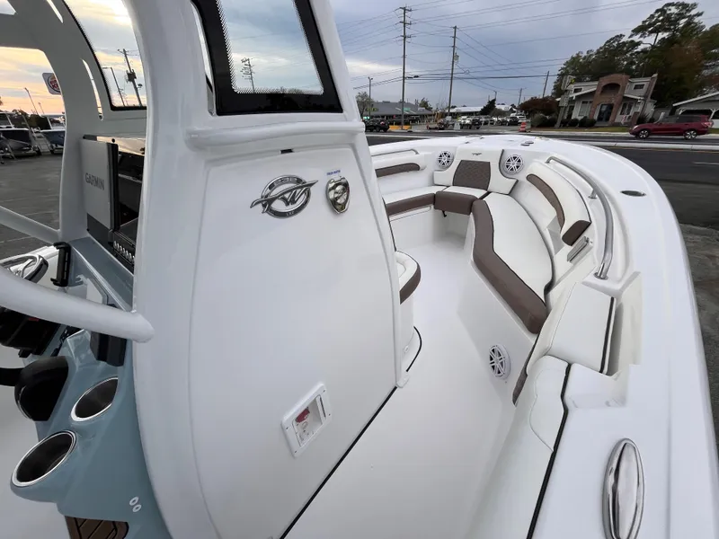 Slide: The Image of 2025 Tidewater 232 LXF boat interior with sleek seating and modern design. - 10