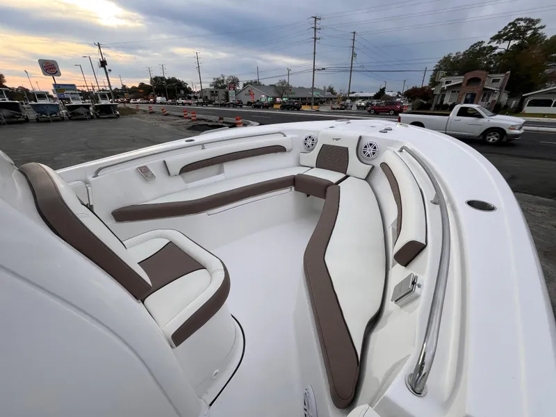 Slide: The Image of 2025 Tidewater 232 LXF boat interior with cushioned seating and modern design. - 11