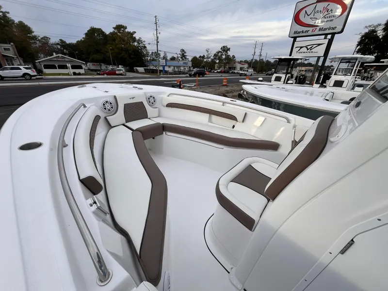 Slide: The Image of 2025 Tidewater 232 LXF boat interior with cushioned seating and modern design. - 13