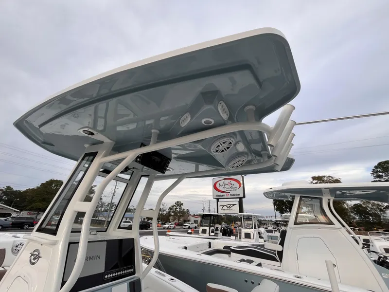 Slide: The Image of 2025 Tidewater 232 LXF boat with advanced T-top design and modern electronics. - 17