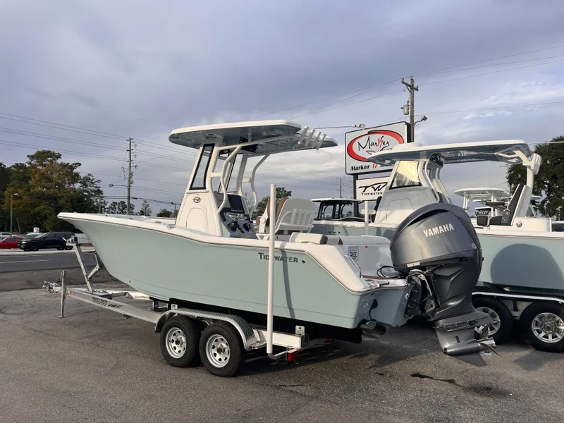 Slide: The Image of 2025 Tidewater 232 LXF boat on trailer with Yamaha engine, parked outdoors. - 3