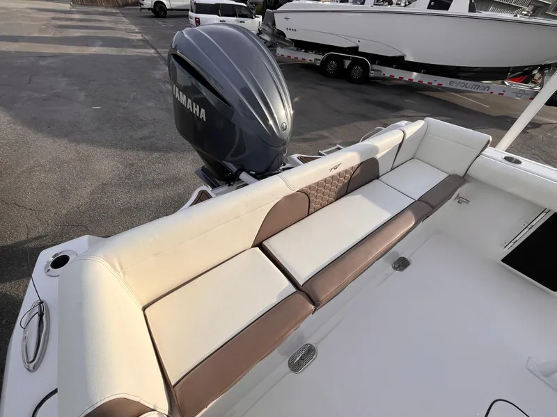 Slide: The Image of 2025 Tidewater 232 LXF boat with Yamaha engine, featuring spacious seating area. - 6