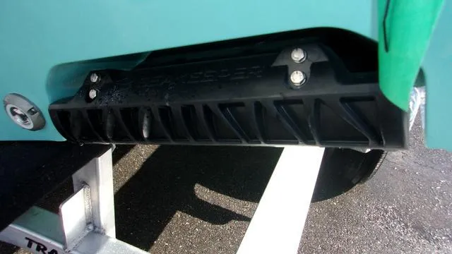 Slide: The Image of Close-up of 2025 Sportsman Heritage 261 boat hull detail on trailer. - 4