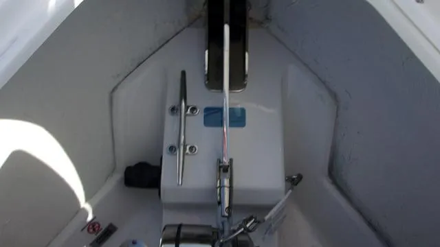 Slide: The Image of 2025 Sportsman Heritage 261 boat interior with anchor and cleat. - 9