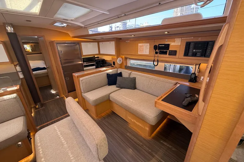 Slide: The Image of Luxurious interior of 2022 Dufour 530 yacht with modern seating and navigation equipment. - 11