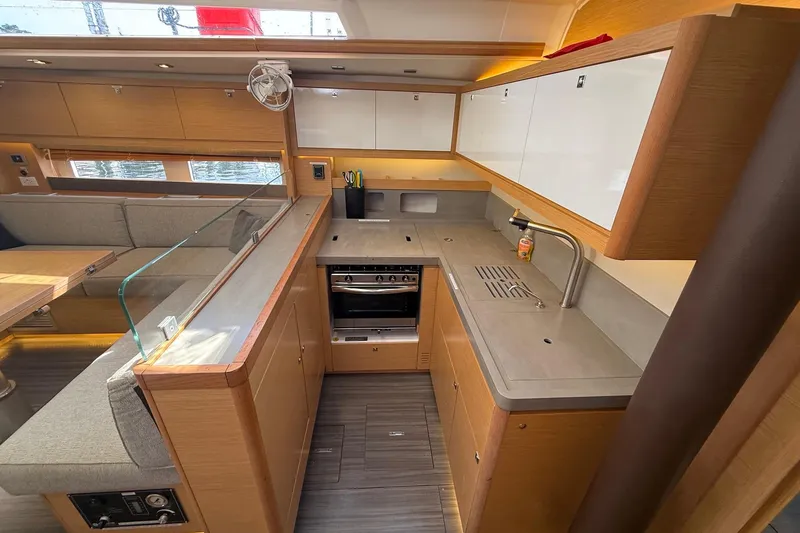 Slide: The Image of Modern kitchen interior of 2022 Dufour 530 yacht with sleek design and ample storage. - 15