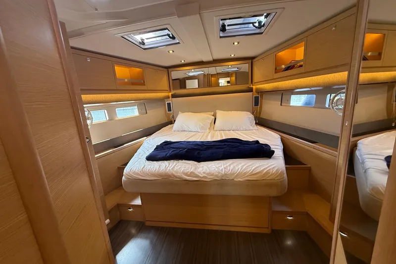 Slide: The Image of Luxurious cabin interior of 2022 Dufour 530 yacht with cozy bedding and modern design. - 19