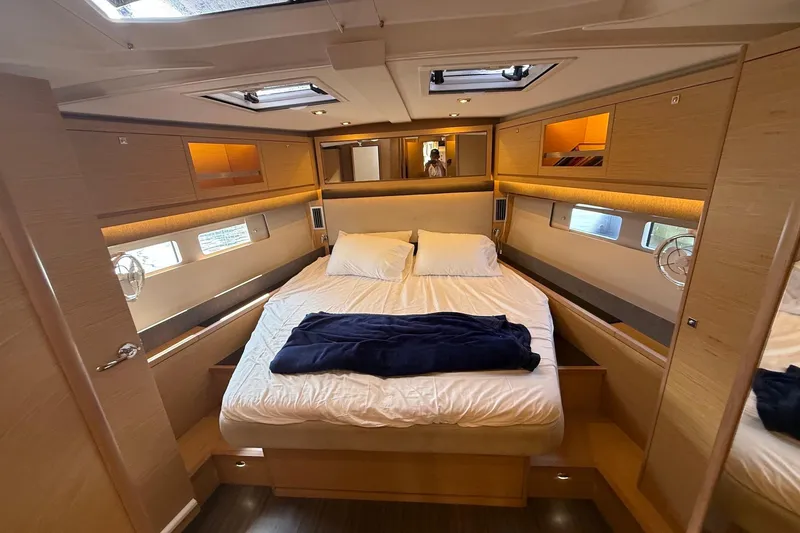 Slide: The Image of Luxurious cabin interior of 2022 Dufour 530 yacht with cozy bedding and modern design. - 20