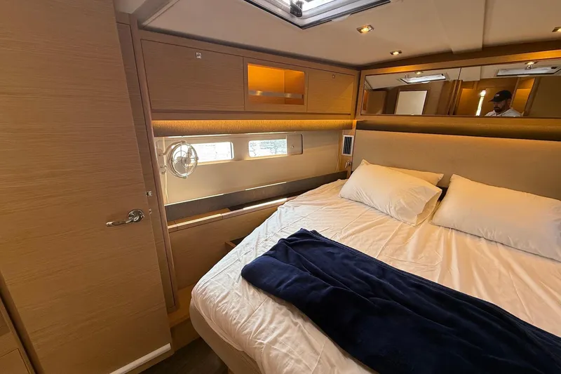 Slide: The Image of Luxurious cabin interior of 2022 Dufour 530 yacht with cozy bedding and modern design. - 22