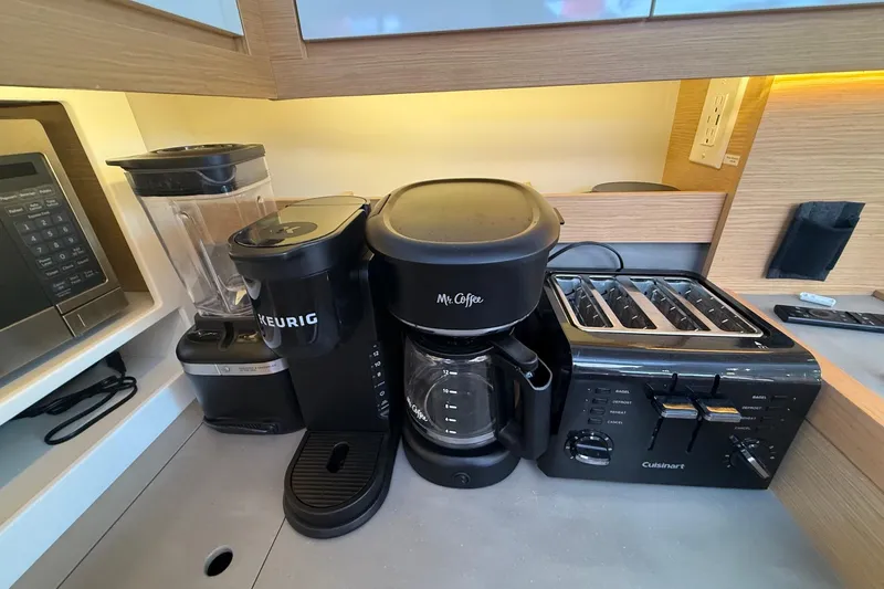 Slide: The Image of Kitchen appliances on Dufour 530 yacht: blender, Keurig, Mr. Coffee maker, Cuisinart toaster. - 27