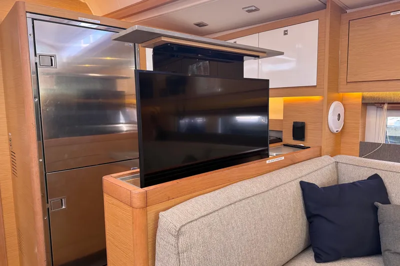 Slide: The Image of Modern interior of 2022 Dufour 530 yacht with pop-up TV and sleek design. - 28
