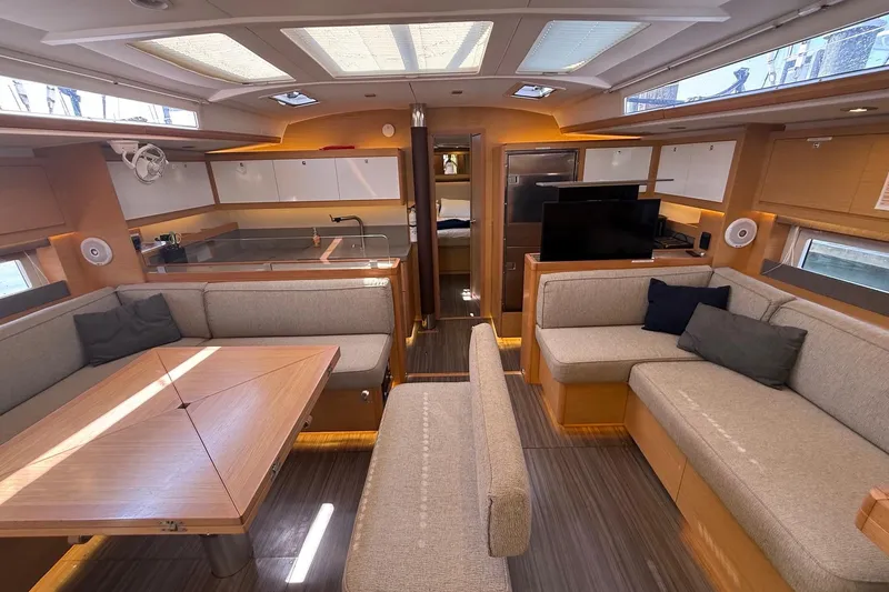 Slide: The Image of Luxurious interior of 2022 Dufour 530 yacht with modern seating and dining area. - 30