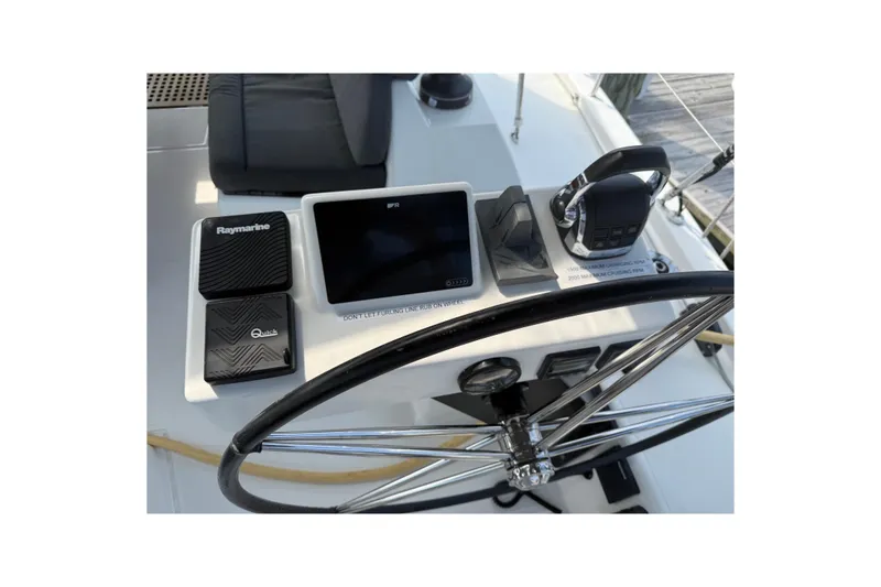 Slide: The Image of Steering console of 2022 Dufour 530 yacht with navigation equipment and controls. - 32