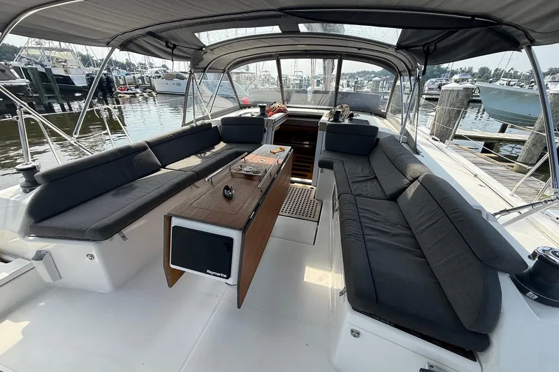 Slide: The Image of Spacious cockpit of 2022 Dufour 530 yacht with comfortable seating and elegant design. - 33
