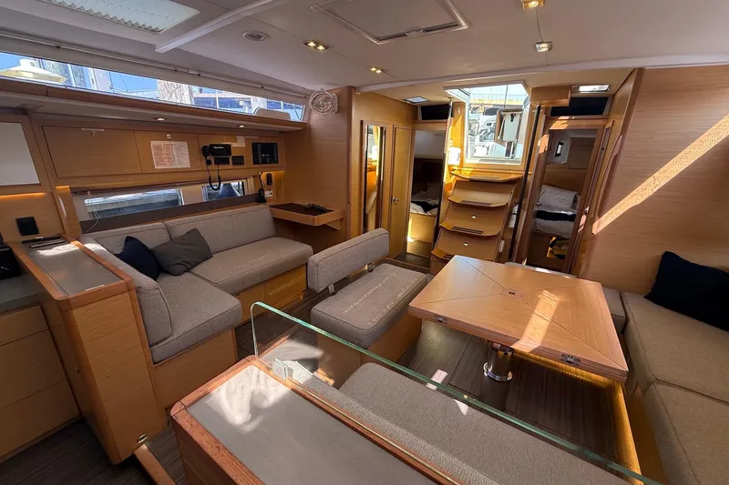 Slide: The Image of Luxurious interior of 2022 Dufour 530 yacht with modern furnishings and ample natural light. - 7