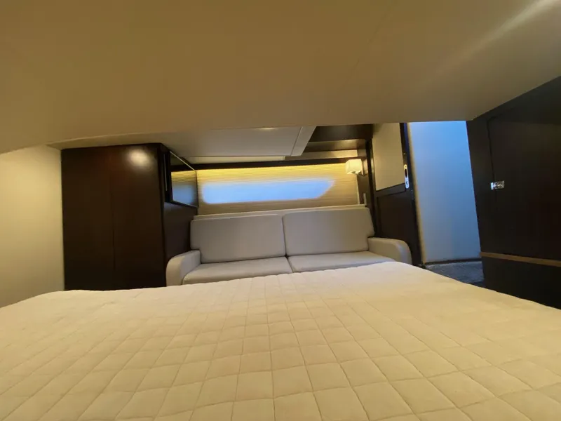 Slide: The Image of Luxurious interior of 2018 Regal 42 Fly yacht with elegant bedding and seating. - 14