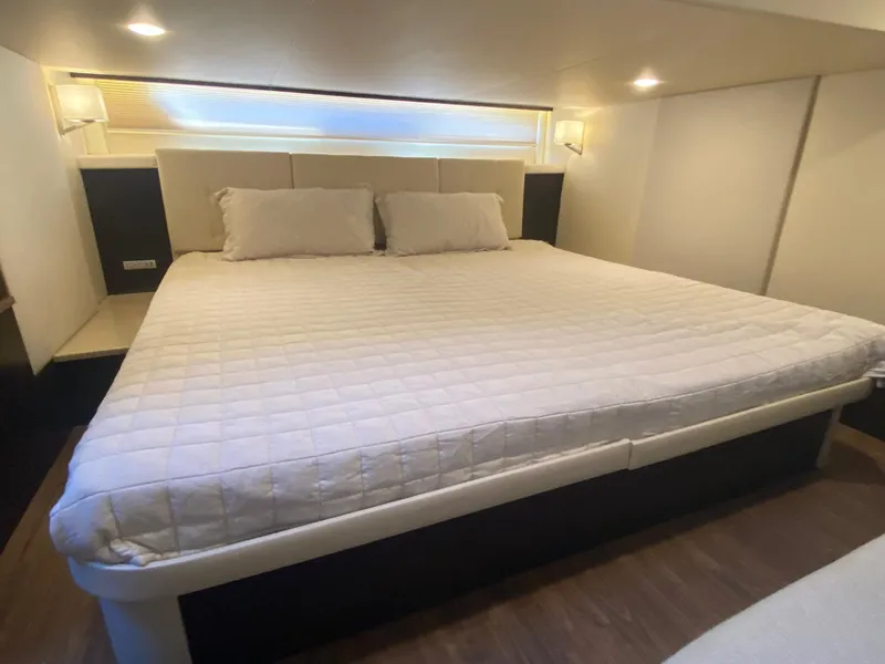 Slide: The Image of Luxurious bedroom interior of 2018 Regal 42 Fly yacht with modern bedding. - 15
