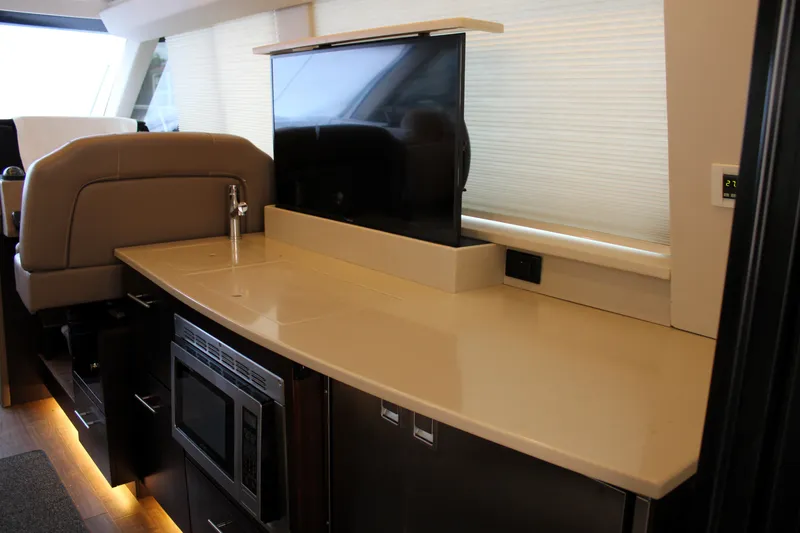 Slide: The Image of Luxurious interior of 2018 Regal 42 Fly yacht with modern kitchen amenities. - 24