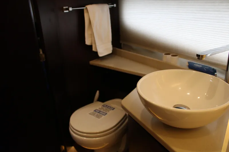Slide: The Image of Luxurious bathroom in 2018 Regal 42 Fly yacht with modern sink and toilet. - 27