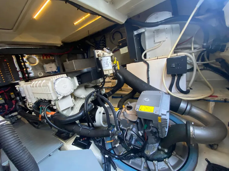 Slide: The Image of Engine room of 2018 Regal 42 Fly yacht, showcasing mechanical components and wiring. - 30