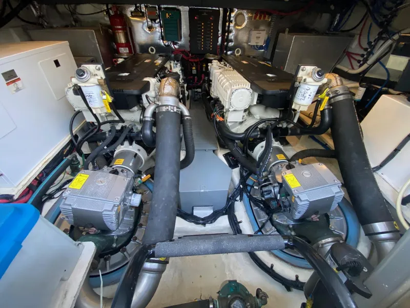 Slide: The Image of Engine room of 2018 Regal 42 Fly yacht, showcasing dual engines and mechanical components. - 32