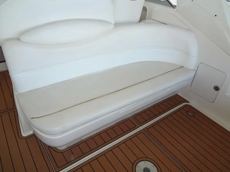 Slide: The Image of White leather seating on 2000 Sea Ray 340 Sundancer boat with teak flooring. - 18