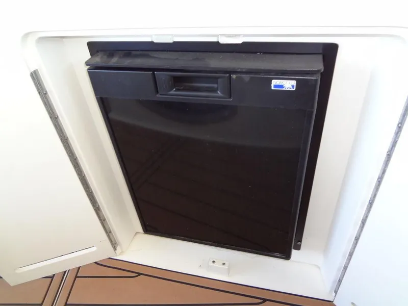 Slide: The Image of Compact black refrigerator on a 2000 Sea Ray 340 Sundancer boat. - 25