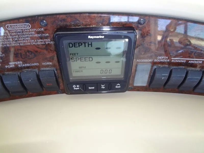 Slide: The Image of Sea Ray 340 Sundancer 2000 dashboard with Raymarine depth and speed display. - 26