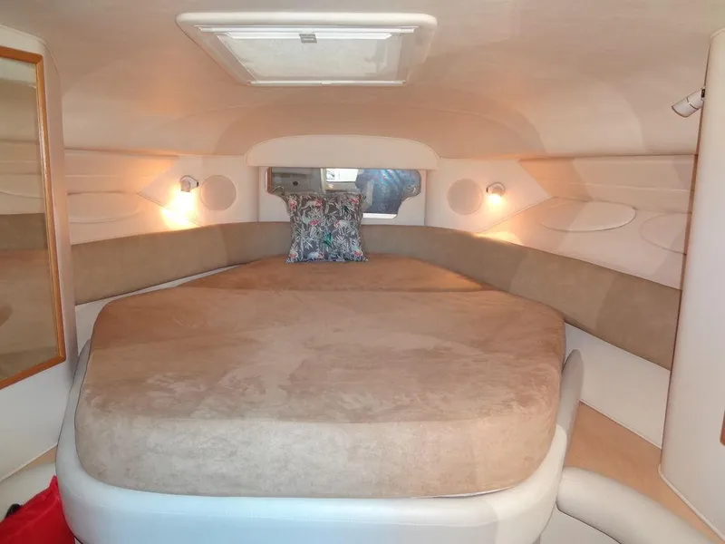Slide: The Image of Interior cabin of 2000 Sea Ray 340 Sundancer with cozy bed and lighting. - 30