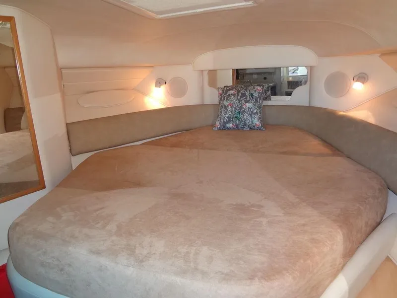 Slide: The Image of Interior cabin of 2000 Sea Ray 340 Sundancer with cozy bed and ambient lighting. - 31