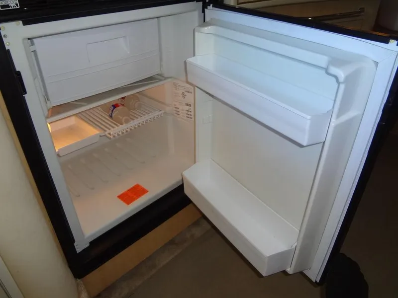 Slide: The Image of Open refrigerator inside a 2000 Sea Ray 340 Sundancer boat. - 38