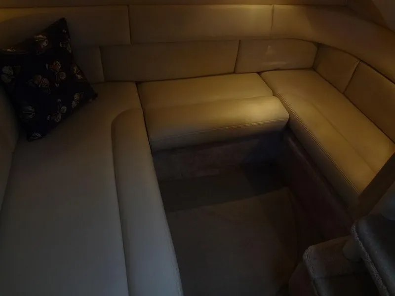 Slide: The Image of Interior seating area of 2000 Sea Ray 340 Sundancer yacht, featuring beige upholstery. - 40